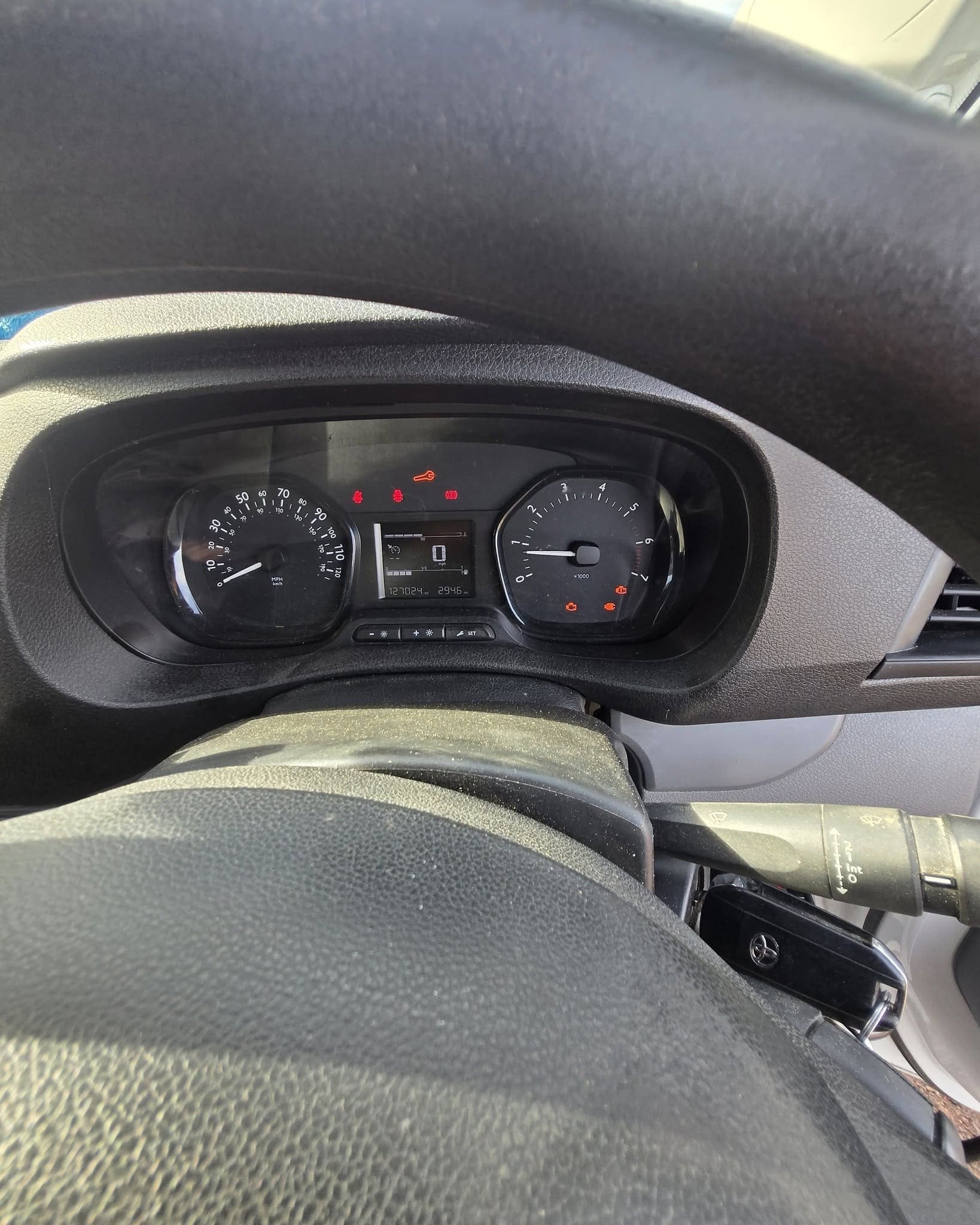Diesel dashboard with DPF and engine management warning lights illuminated