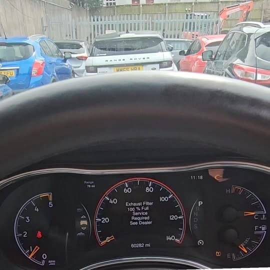 Jeep Grand Cherokee instrument cluster showing DPF and engine warning lights