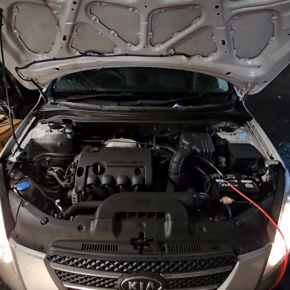Kia petrol engine bay with test leads connected at Pro Remapping