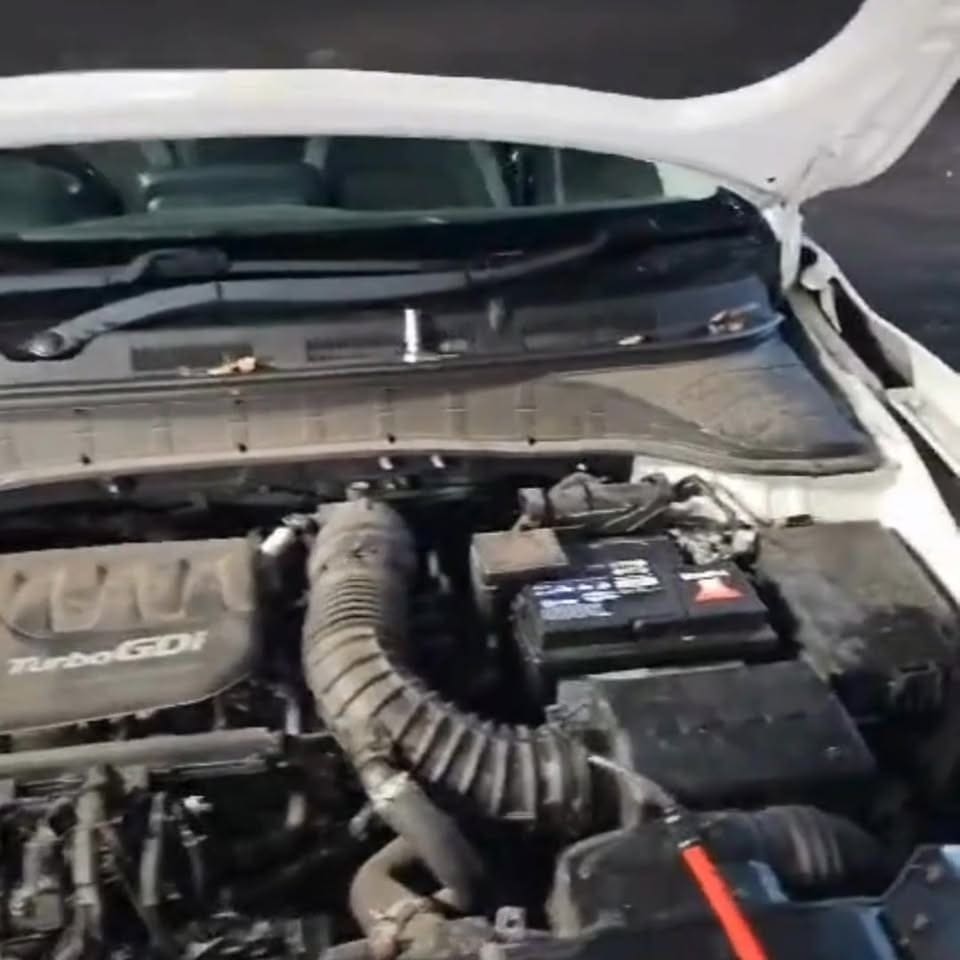 Vauxhall engine bay with the bonnet up during under-bonnet checks at Pro Remapping